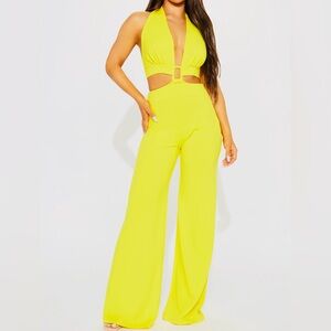 Yellow Halter back Jumpsuit. Definite statement piece. NWT SzL. You’ll love it